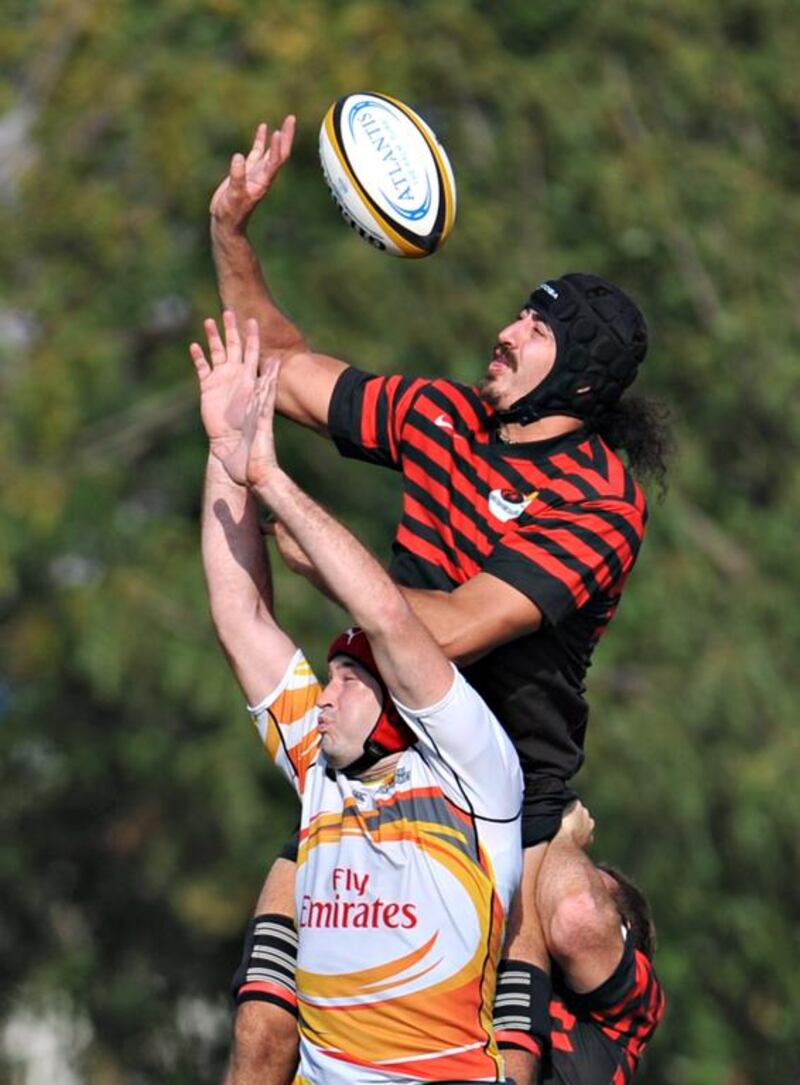 An Abu Dhabi Saracen prepares to receive the ball during their 21-18 win over Dubai Hurricanes at The Sevens in Dubai City, Dubai on February 28, 2014. Jeff Topping for The National