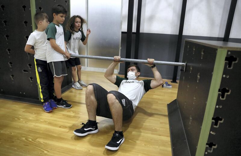 DUBAI, UNITED ARAB EMIRATES , November 4 – 2020 :- Harry Murden, British Spiderman teaching kids how to parkour at the Parkour DXB in Al Quoz in Dubai. (Pawan Singh / The National) For POAN. Story Sarwat 