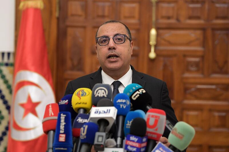 Tunisia's Prime Minister-designate Hichem Mechichi announces to the press his new government during a press conference in Carthage, on August 24, 2020. Tunisia's prime minister-designate on Tuesday unveiled the country's second government in six months, which must now seek approval from lawmakers incensed by how the administration was formed. / AFP / Fethi Belaid

