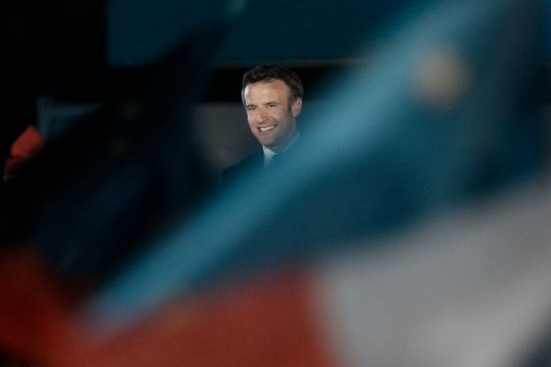 Emmanuel Macron celebrates in Paris after being re-elected as French president. AP Photo