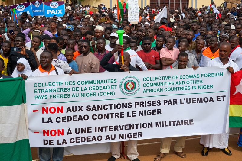 Supporters of the junta protest in Niamey against military intervention proposed by Ecowas. EPA