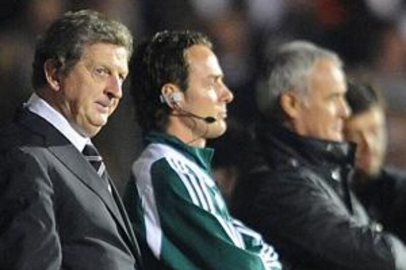 Roy Hodgson, left, watches Fulham draw 1-1 with Roma.