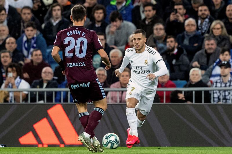 Real Madrid's winger Eden Hazard in action against Celta Vigo's defender Kevin Vazquez. EPA