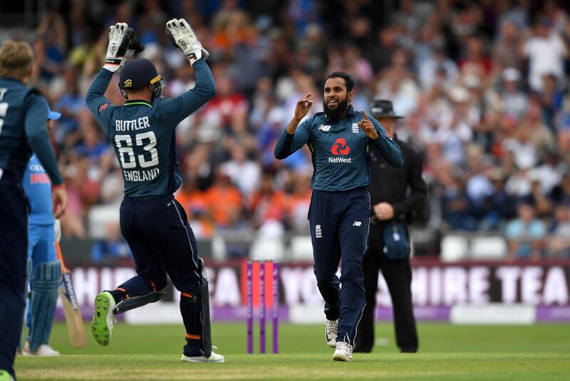 LEEDS, ENGLAND - JULY 17:  Adil Rashid of England celebrates dismissing Suresh Raina of India during the 3rd Royal London One-Day International match between England and India at Headingley on July 17, 2018 in Leeds, England.  (Photo by Gareth Copley/Getty Images)