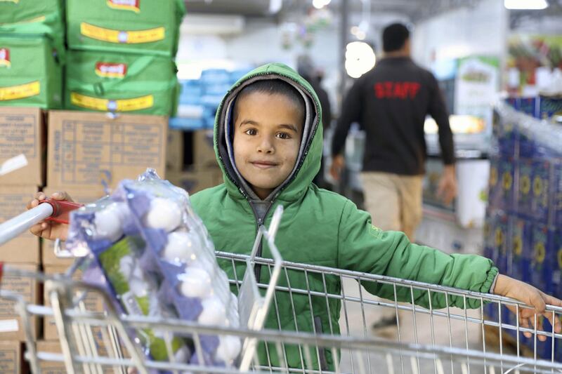 Young Syrian refugee boy in a World Food Programme-run supermarket in Zaatari refugee camp. All refugees in the camp receive monthly cash assistance from WFP, facilitated by the ‘Building Blocks’ blockchain system. Courtesy WFP / Mohammad Batah