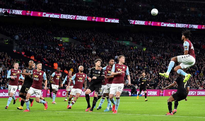 Aston Villa defender Tyrone Mings jumps to defend a corner. AFP