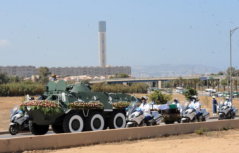 Algerian security forces accompany the coffin of former president Abdelaziz Bouteflika to the El Alia cemetery in Algiers, Algeria, 19 September 2021.  Former President of Algeria Abdelaziz Bouteflika died at the age of 84.  EPA