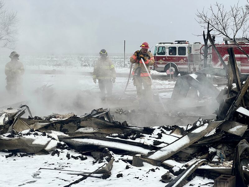 Firefighters extinguish a hot spot from the Smokehouse Creek fire in Stinnett, Texas. AP