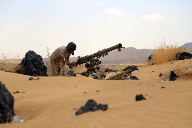 A fighter loyal to Yemen's Saudi-backed government takes position during the fight against Houthi militiamen in the northeastern province of Marib. EPA