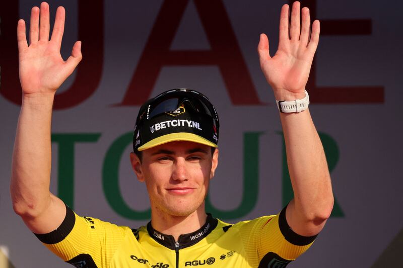 Team Visma-Lease a Bike's Dutch cyclist Olav Kooij celebrates after winning the fifth stage of the UAE Tour. AFP