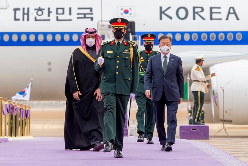 Saudi Crown Prince Mohammed bin Salman, right, accompanies South Korean President Moon Jae-in, at Riyadh's international airport, Saudi Arabia, on Tuesday. AP