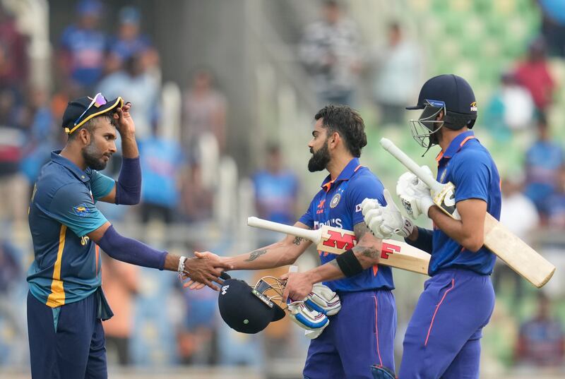 Sri Lanka captain Dasun Shanaka congratulates Virat Kohli on reaching 150. AP