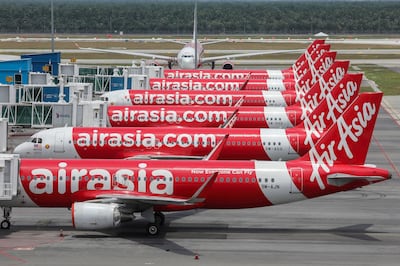 FILE PHOTO: AirAsia planes are seen parked at Kuala Lumpur International Airport 2, during the movement control order due to the outbreak of the coronavirus disease (COVID-19), in Sepang, Malaysia April 14, 2020. REUTERS/Lim Huey Teng/File Photo  GLOBAL BUSINESS WEEK AHEAD