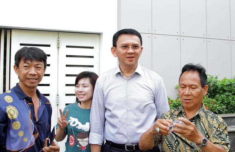 The former governor of Jakarta, Basuki Tjahaja Purnama, better known as Ahok (second right), votes in this April’s gubernatorial election. Despite being the overwhelming favourite, anti-Ahok protests turned public sentiment against him. Riau Images / Barcroft Images