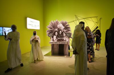 Visitors to Christopher Benton's exhibition at Abu Dhabi Art on opening night. Vidhyaa Chandramohan for The National