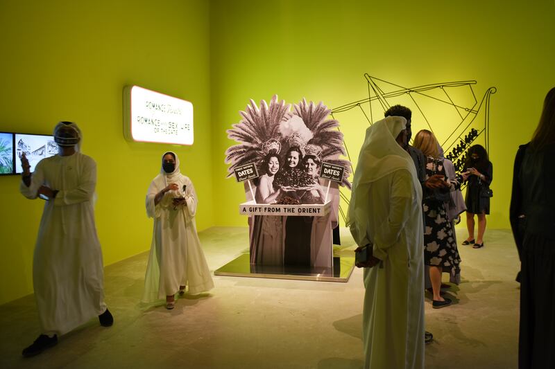 Visitors to Abu Dhabi Art view Christopher Benton's 'The World Was My Garden'.  Vidhyaa Chandramohan / The National