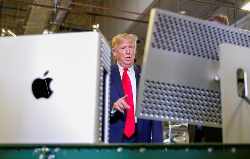 Donald Trump views Apple products. Reuters