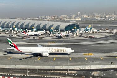 Emirates planes on the tarmac at Dubai International Airport. The airline said it will recall more furloughed pilots as business picks up. Reuters