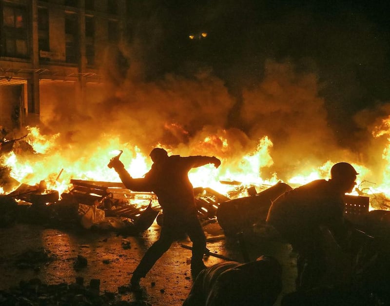 Protesters clash with riot police at Independence Square during protests in central Kiev, Ukraine. EPA