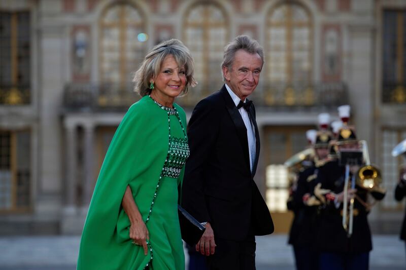 Bernard Arnault, chairman and chief executive of LVMH Moet Hennessy, and his wife Helene Mercier-Arnault arrive for the occasion. AP