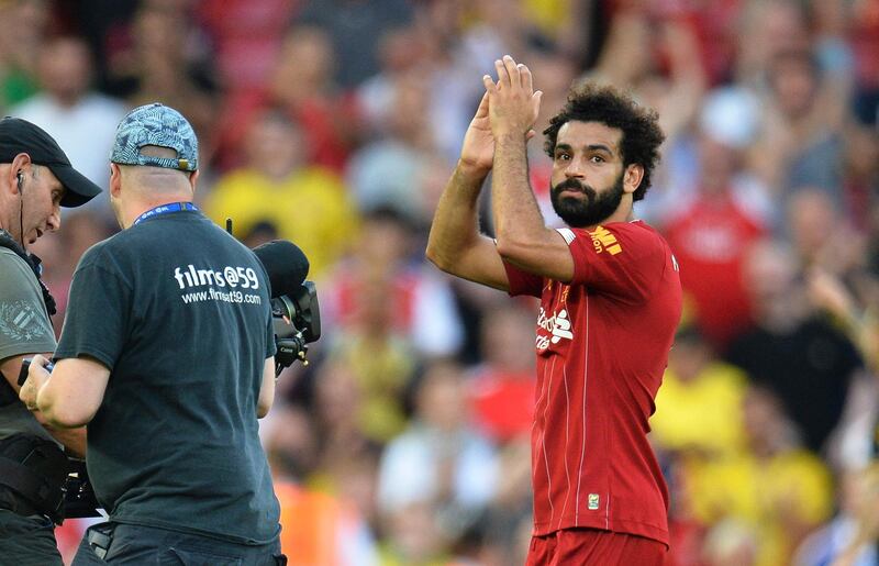 epa07791378 Liverpool's Mohamed Salah (R) reacts after the English Premier League soccer match between Liverpool FC and Arsenal FC at Anfield in Liverpool, Britain, 24 August 2019.  EPA/PETER POWELL EDITORIAL USE ONLY. No use with unauthorized audio, video, data, fixture lists, club/league logos or 'live' services. Online in-match use limited to 120 images, no video emulation. No use in betting, games or single club/league/player publications