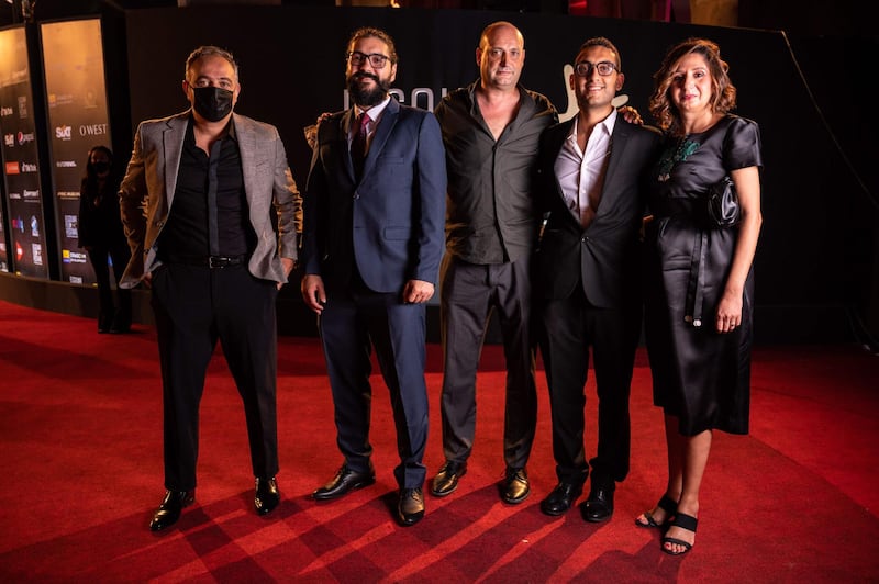 Mohamed Hefzy, Ameen Nayfeh, Clarens Grollmann, Kamal El Mallakh and May Odeh, arrive for the screening of '200 Metres' on day three of the fourth El Gouna Film Festival. AFP