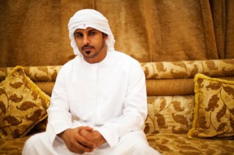 ABU DHABI, UAE - October 2, 2011- Nasser Ahmed Al Musabi, a friend of Theyab Awana, sits in his home reflecting on the accident that killed his friend.  Theyab Awana, the talented 21-year-old UAE footballer who became an overnight internet sensation following a back-heeled penalty, died on September 25 after being involved in a car accident in Abu Dhabi.    (Andrew Henderson / The National) 