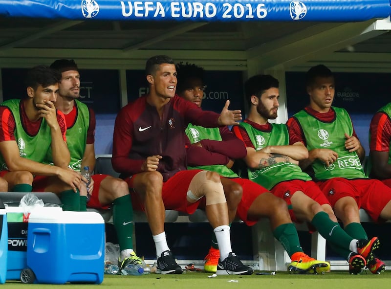 PARIS, FRANCE - JULY 10:  Cristiano Ronaldo of Portugal shouts encouragement to his teammates from te bench during extra-time of the UEFA EURO 2016 Final match between Portugal and France at Stade de France on July 10, 2016 in Paris, France.  (Photo by Clive Rose/Getty Images)