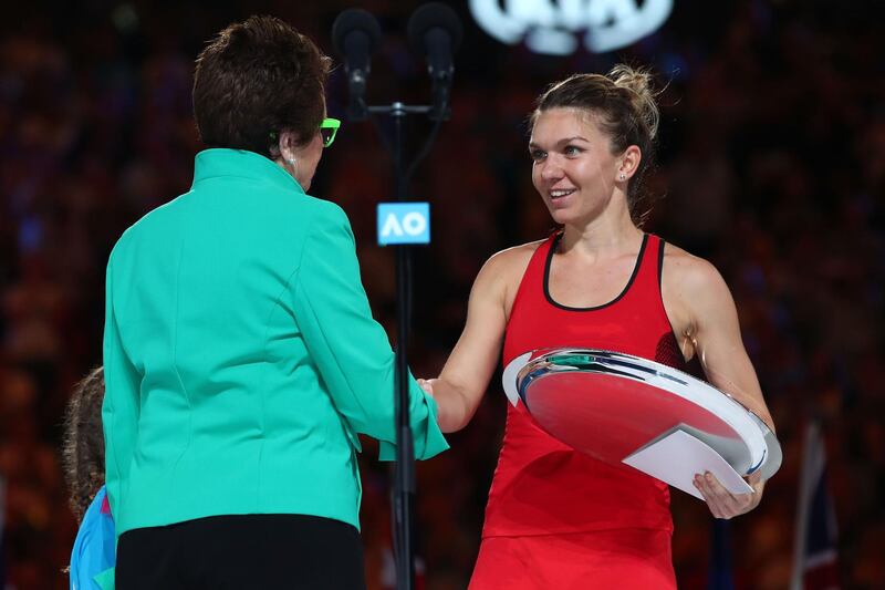 MELBOURNE, AUSTRALIA - JANUARY 27:  Billie Jean King presents Simona Halep of Romania with the runners-up trophy after losing the women's singles final to Caroline Wozniacki of Denmark on day 13 of the 2018 Australian Open at Melbourne Park on January 27, 2018 in Melbourne, Australia.  (Photo by Clive Brunskill/Getty Images)