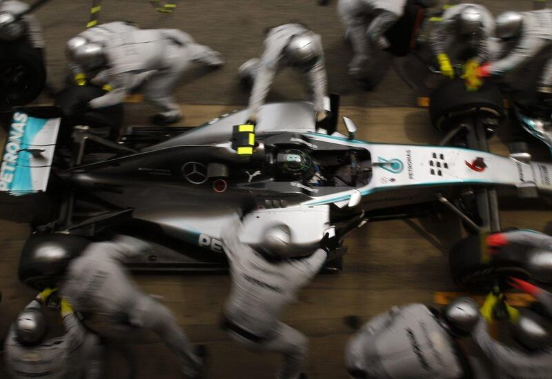 Mercedes driver Nico Rosberg gets a pit service during Sunday's Spanish Grand Prix. Emilio Morenatti / AP / May 11, 2014  