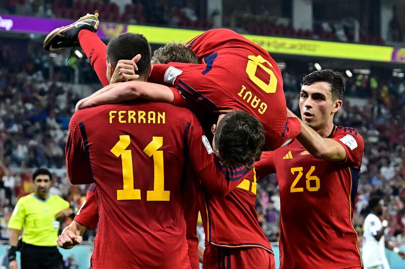 Ferran Torres celebrates with his teammates after scoring Spain's third goal from the penalty spot in their 7-0 thumping of Costa Rica at Al Thumama Stadium. AFP