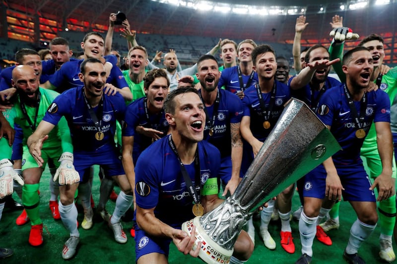 Chelsea's Cesar Azpilicueta lifts the trophy as they celebrate winning the Europa League .REUTERS