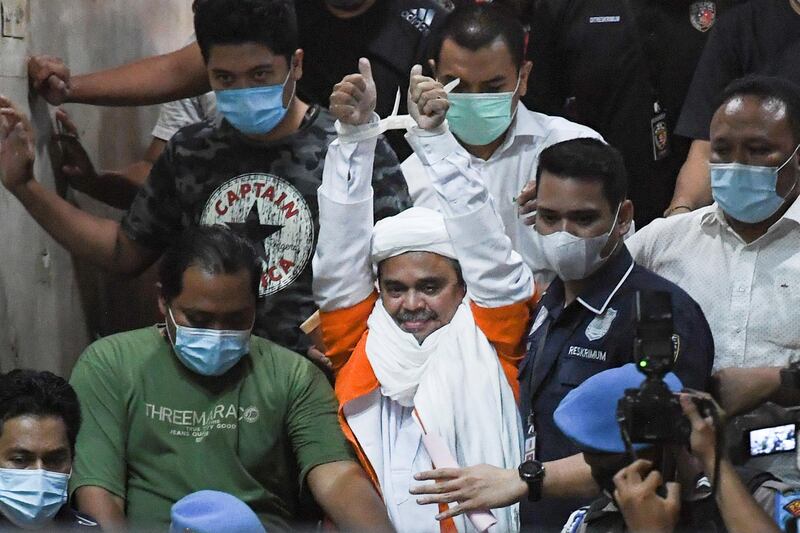 Indonesian police arrest firebrand Islamic cleric Rizieq Shihab on suspicion of having breached coronavirus restrictions by holding events that drew thousands of followers in the city at the Mapolda Metro Jaya in Jakarta, Indonesia. Reuters