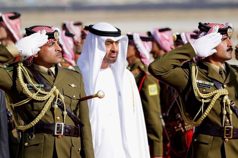 Sheikh Mohamed bin Zayed reviews the Jordan Royal guard of Honour, at Queen Alia Airport in Amman, Jordan. Andre Pain /  EPA