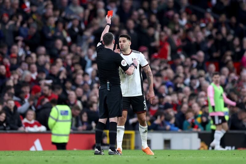 Fulham's Aleksandar Mitrovic is shown a red card by referee  Chris Kavanagh. Getty