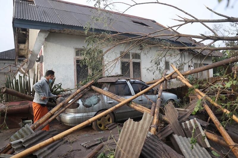 Lava and ash from the volcano damaged cars and homes in surrounding areas. AP