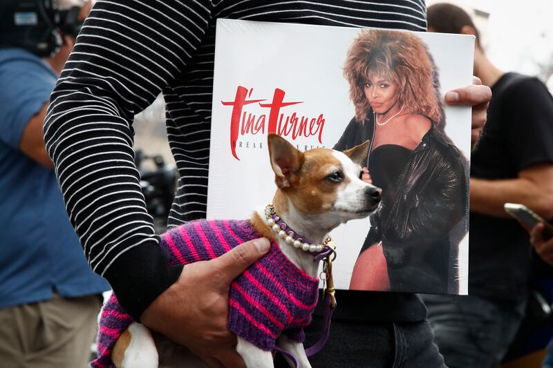 A fan holds one of Turner's records next to her Hollywood Walk of Fame Star in Los Angeles, California. EPA