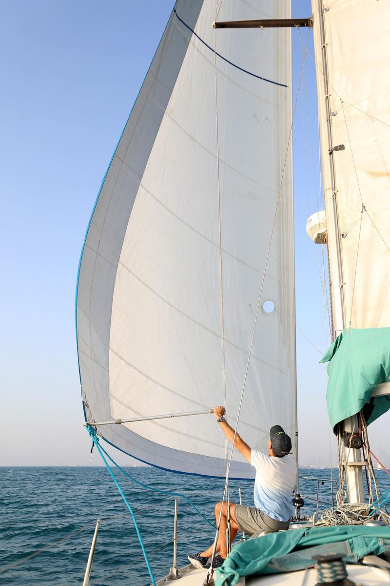 Dubai, United Arab Emirates - May 14, 2019: Devrim Anadol takes part in the Dubai offshore sailing club pursuit race. Tuesday the 14th of May 2019. Dubai. Chris Whiteoak / The National