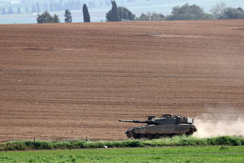 An Israeli tank drives near the border with the northern Gaza Strip amid ongoing fighting in the enclave as Ramadan approaches. EPA