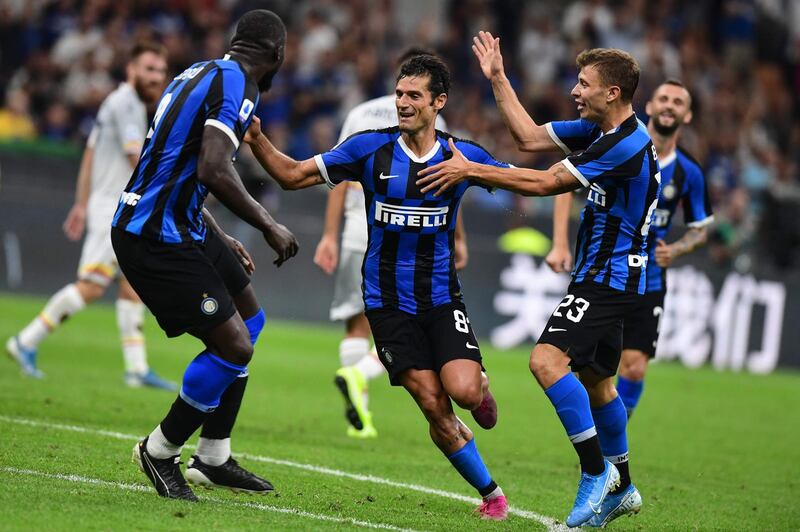 Inter Milan's Italian forward Antonio Candreva celebrates scoring with Romelu Lukaku and Nicolo Barella. AFP