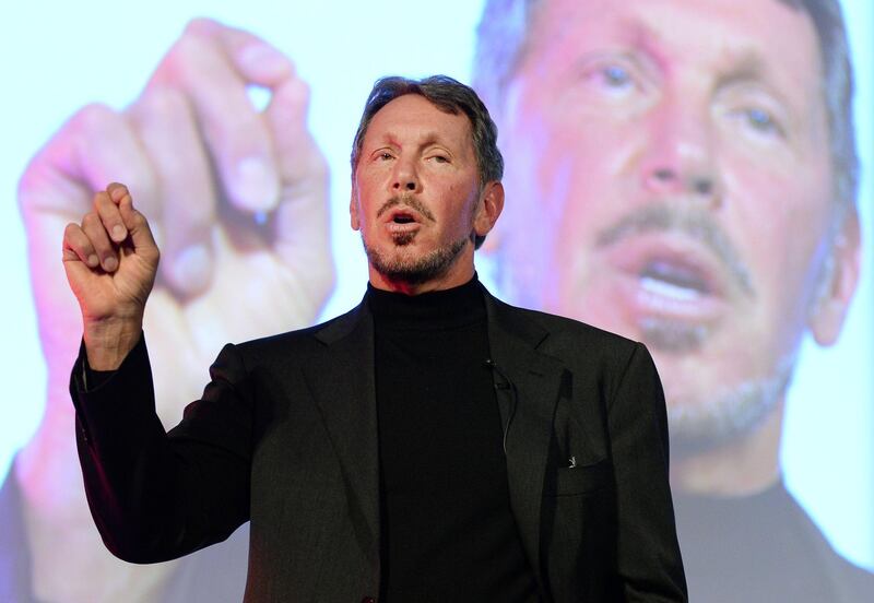 Larry Ellison, CEO of Oracle Corporation, gestures as he makes a speech during the New Economy Summit 2014 in Tokyo on April 9, 2014.  More than 1,000 business leaders, entrepreneurs, businessmen and students took part in the two-day forum.     AFP PHOTO/Toru YAMANAKA (Photo by TORU YAMANAKA / AFP)