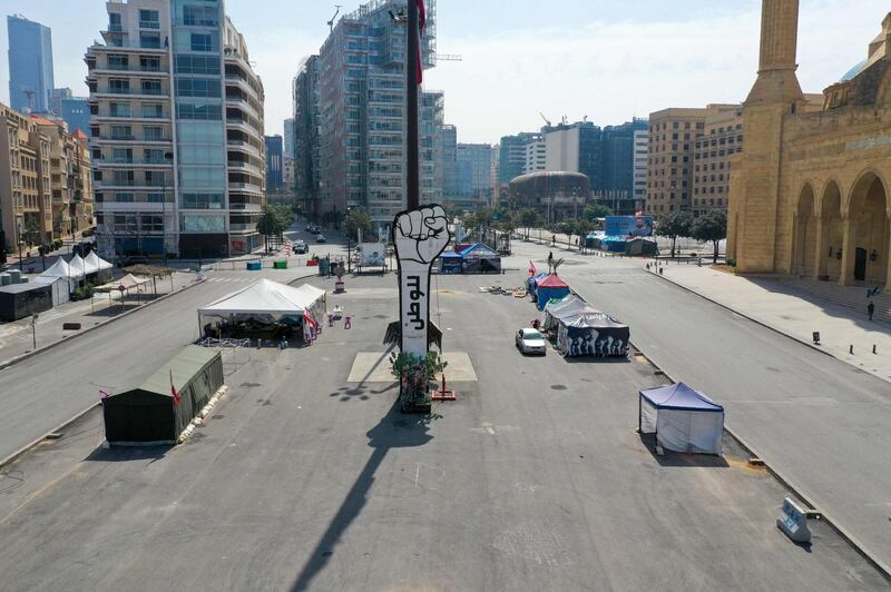 An aerial view shows the Lebanese capital Beirut's Martyrs Square that was until recent months the gathering place of anti-government demonstrators, almost deserted during the novel coronavirus crisis, on March 26, 2020. / AFP / -
