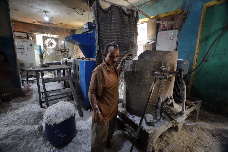 Recycling workers manufacture plastic in the Manchiyet Nasser area of Mokattem, in Cairo. Leaders of the Zabbaleen community in Mokattem say 5,000 tonnes of waste are collected every day. They estimate that up to 85 per cent of the rubbish collected is recycled.  All photos: EPA