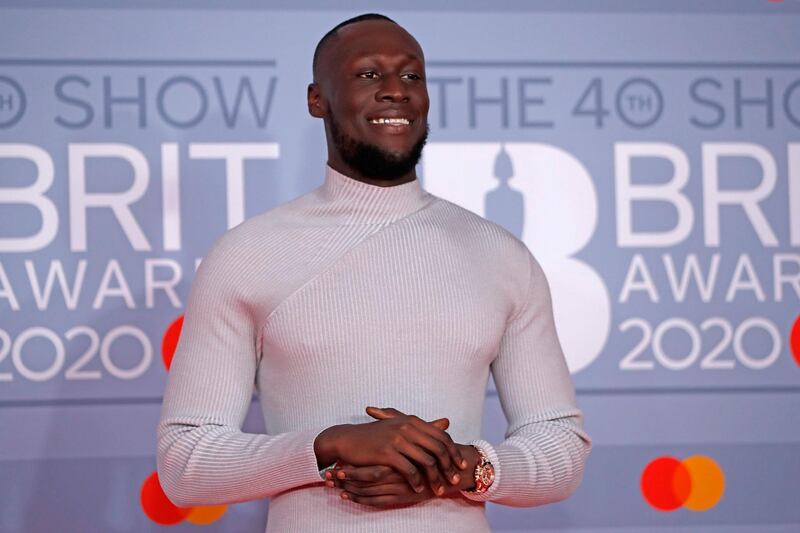 British grime and hip-hop artist Stormzy poses on the red carpet on arrival for the BRIT Awards 2020 in London on February 18, 2020. RESTRICTED TO EDITORIAL USE – NO POSTERS – NO MERCHANDISE– NO USE IN PUBLICATIONS DEVOTED TO ARTISTS
 / AFP / Tolga AKMEN / RESTRICTED TO EDITORIAL USE – NO POSTERS – NO MERCHANDISE– NO USE IN PUBLICATIONS DEVOTED TO ARTISTS

