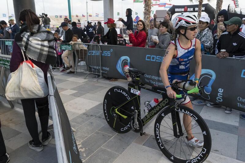DUBAI, UNITED ARAB EMIRATES, 29 JANUARY 2016. The Ironman 70.3 Dubai Triathlon held on Sunset Beach next to the Burj Al Arab. A female contestant at the start of the cycle stage. (Photo: Antonie Robertson/The National) ID: None. Journalist: None. Section: Sport.