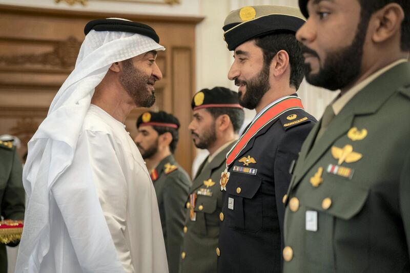ABU DHABI, UNITED ARAB EMIRATES - October 14, 2019: HH Sheikh Mohamed bin Zayed Al Nahyan, Crown Prince of Abu Dhabi and Deputy Supreme Commander of the UAE Armed Forces (L) awards a member of the UAE Armed Forces with a Medal, during a Sea Palace barza.

( Rashed Al Mansoori / Ministry of Presidential Affairs )
---