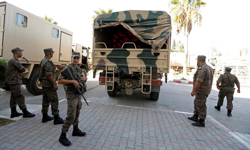 Soldiers stand guard as military trucks transport ballot boxes and election material to be distributed to polling stations, ahead of the Sunday's parliamentary election, in Tunis, Tunisia October 5, 2019. REUTERS/Zoubeir Souissi