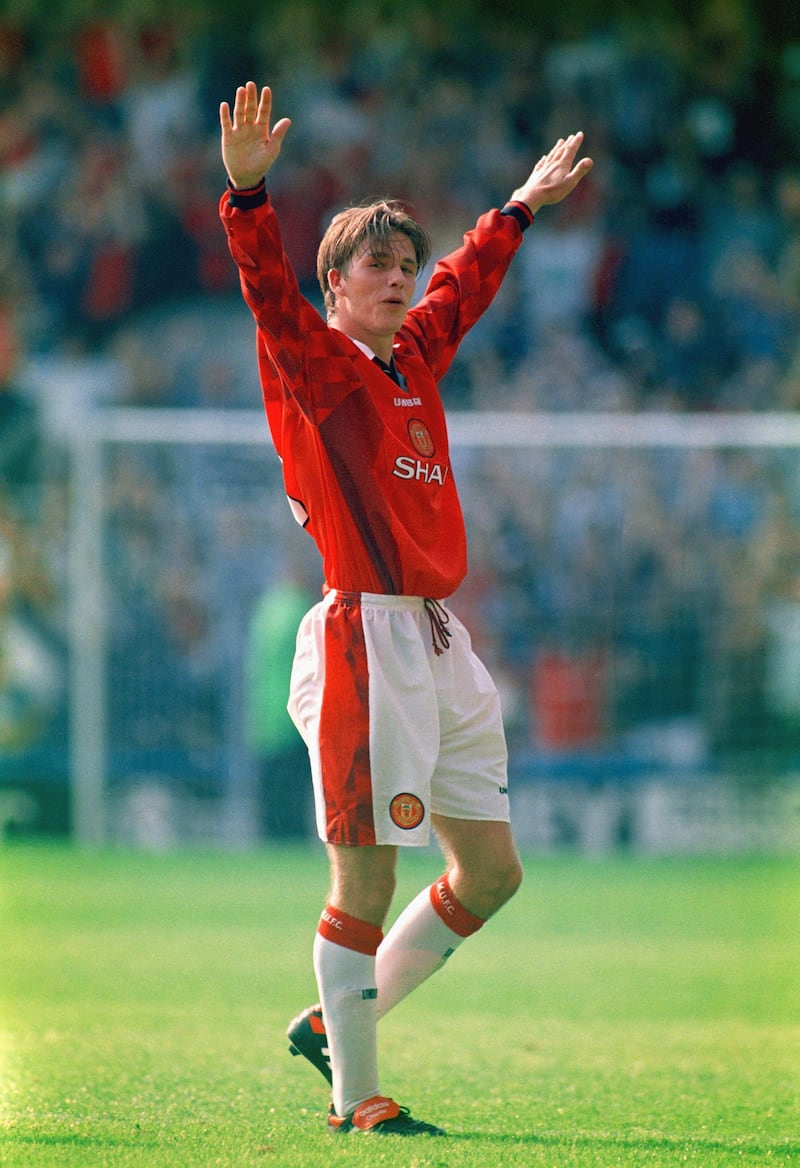 LONDON, UNITED KINGDOM - AUGUST 17:  Manchester United player David Beckham celebrates after scoring the third goal with a spectacular effort from the halfway line, during the Premier League match between Wimbledon and Manchester United at Selhurst Park on August 17, 1996 in London, England. (Photo by Michael Cooper/Allsport/Getty Images)