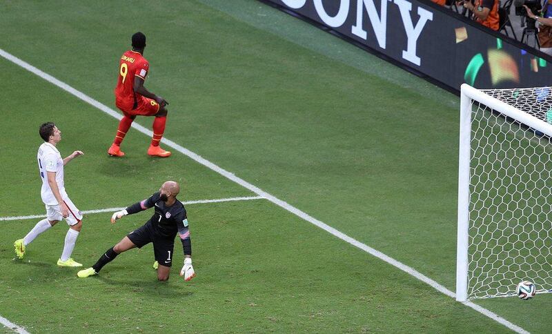 Romelu Lukaku of Belgium, far, scores the second goal for the team to make it 2-0 against the USA on Tuesday at the 2014 World Cup. Ali Haider / EPA