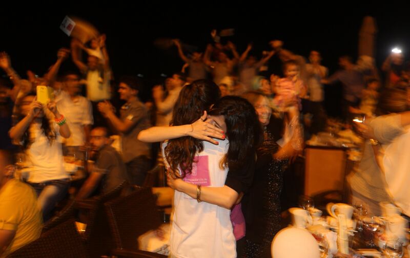 People celebrate Palestinian singer Mohammed Assaf's winning of "Arab Idol" in Gaza City June 22, 2013.    AFP PHOTO/MAHMUD HAMS
 *** Local Caption ***  403921-01-08.jpg